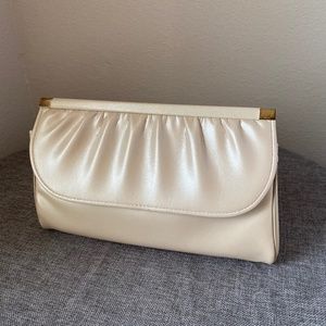 Rome Clutch Ivory/Buff with a nice Pearly sheen.